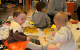 Sensory workshop toddlers (boy and girl) playing with sensory materials
