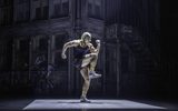 Tyrone Jackson (Amonik Melaco) stood in a running pose on a street. Credit: Johan Persson